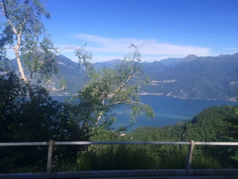 Lake Como seen over a crash barrier from a high mountain road above Esino Lario
