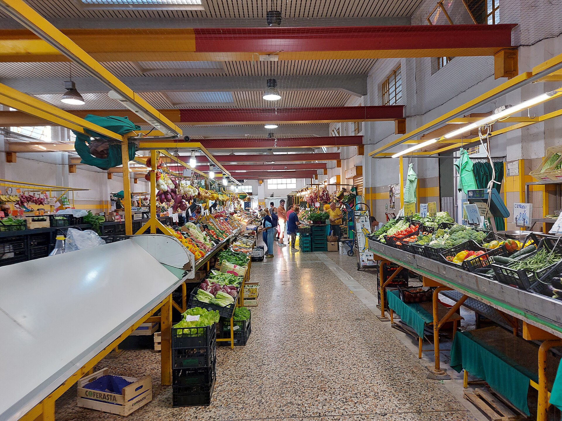Stalls inside the covered market in Como selling local produce