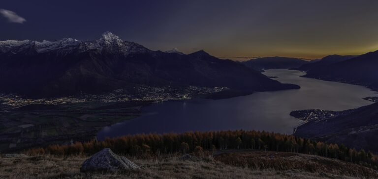 Autumn sunset over the upper Lake Como at Colico with mountains behind