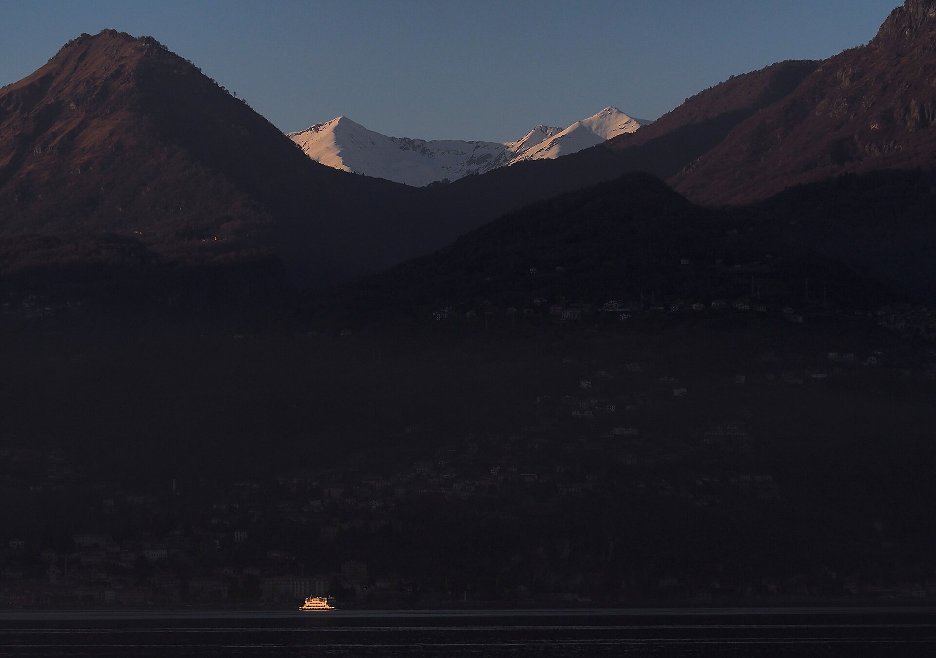 Lake Como in Autumn and Winter: What Is Open, Month by Month 2 Menaggio lakefront in winter with snow on the mountains above Lake Como