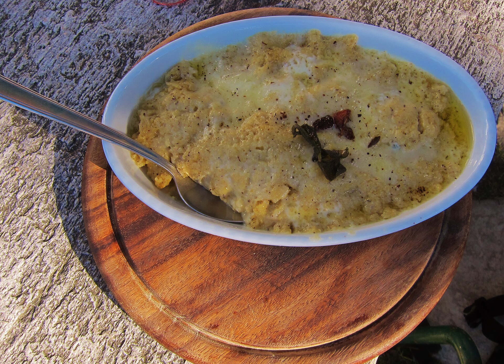 Polenta uncia with melted cheese and butter served at a mountain hut above Lake Como