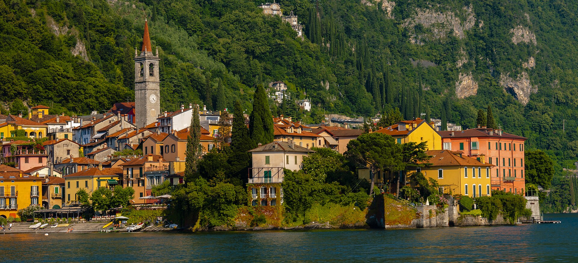 Varenna's pastel houses and harbour seen from the arriving ferry on Lake Como